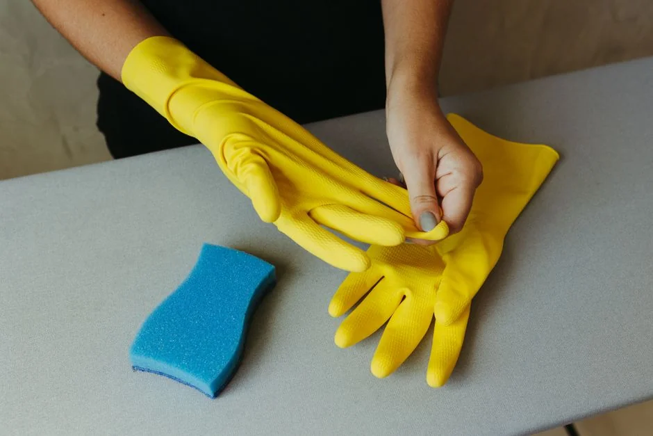 Housekeeper arranging towels in a hotel room, highlighting the craft of cleanliness and service.